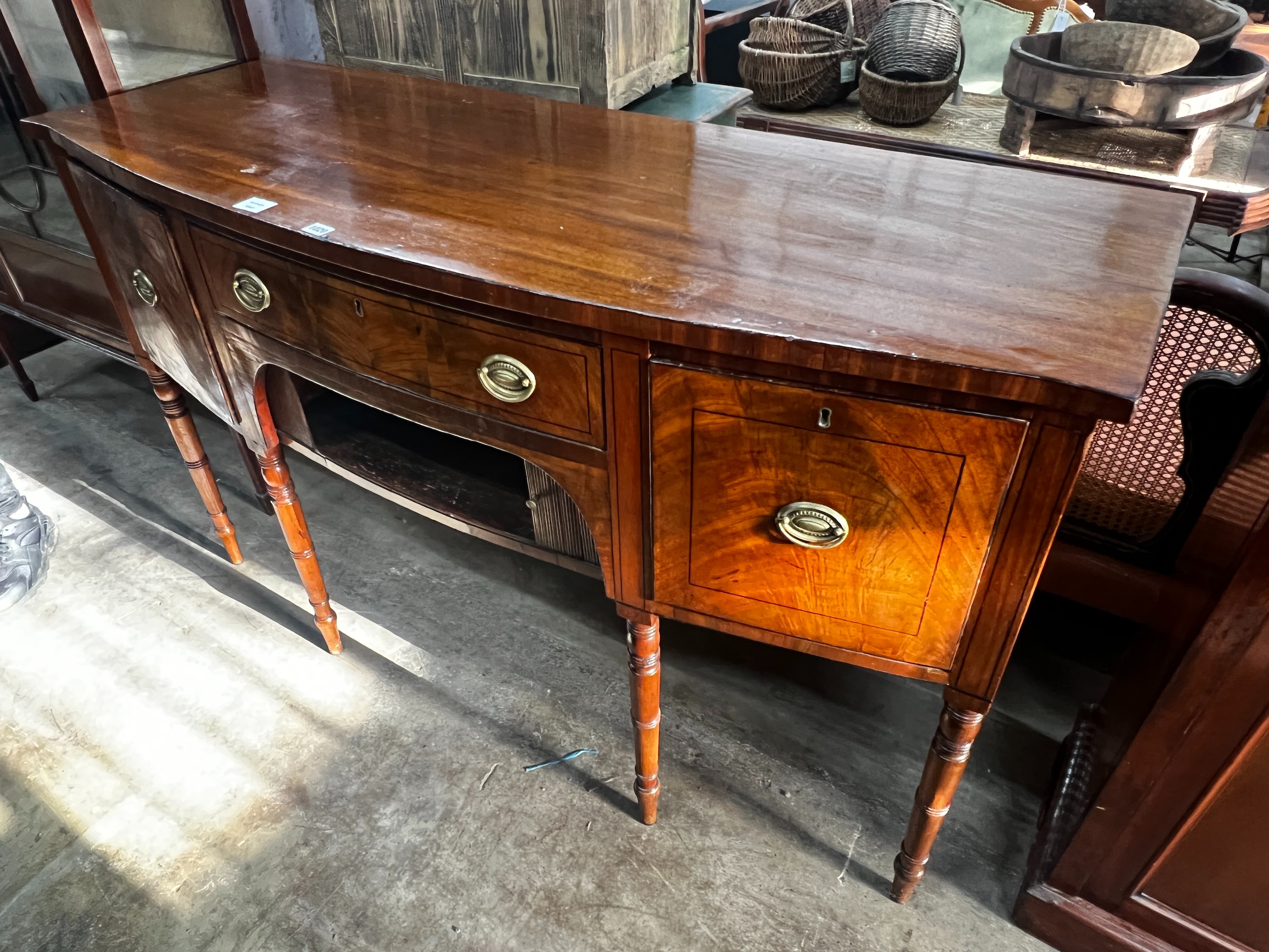 A Regency mahogany bowfronted sideboard, length 153cm, depth 58cm, height 92cm